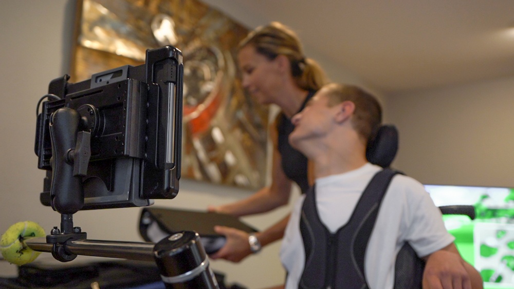 The RAM-101U-IP1 is mounted to the steel bar system on Zach’s wheelchair that was originally supporting a larger Tobii Dynavox device