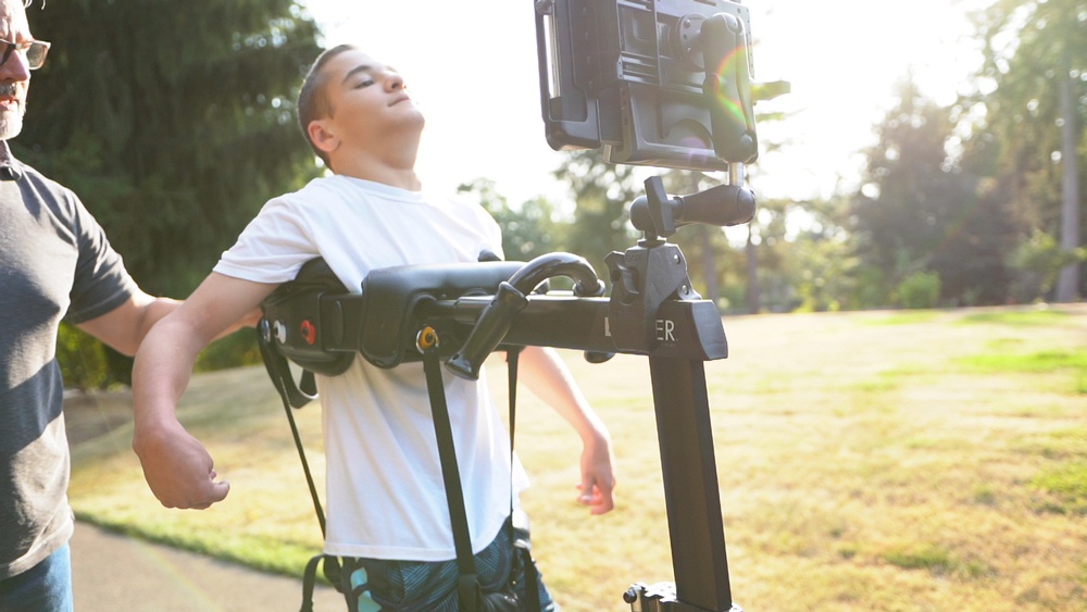 When the E-Pacer mount is used, Zach has the socket arm and holder from his wheelchair mount transferred over these components to create the complete system to support his device.